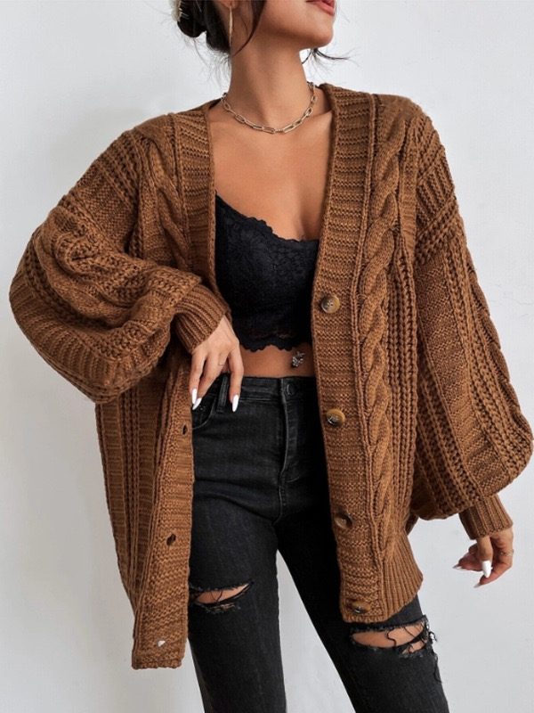 Brown cable cardigan styled on a model